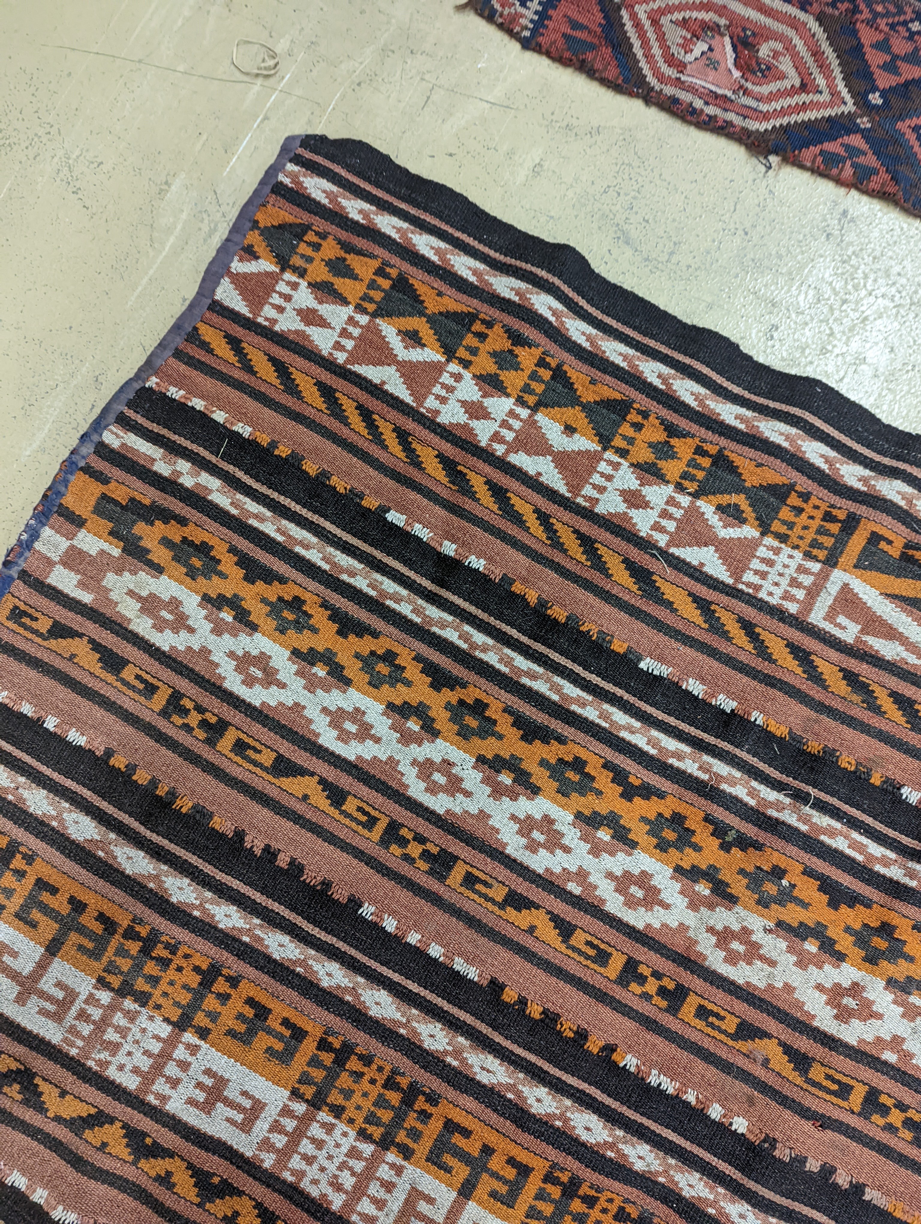 A polychrome flatweave carpet, approx. 330 x 180cm
